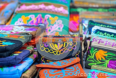 Embroidered handbags for sale at handicraft market Stock Photo