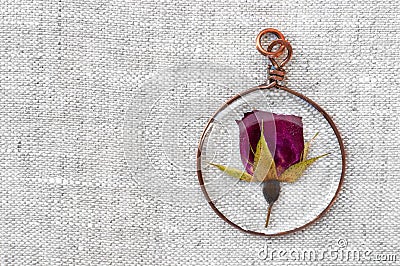 Handmade epoxy resin jewelry. pendant, rose in copper frame Stock Photo