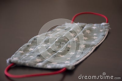 Handmade fabric mask with stars pattern as prevention and protection against viruses and illnes Stock Photo