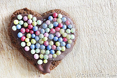 Handmade gingerbread heart decorated with sugar pearls Stock Photo