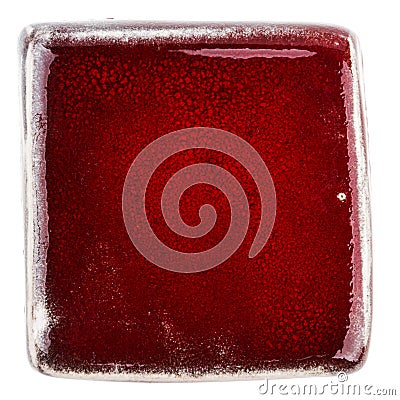 Handmade glazed red ceramic tile Stock Photo