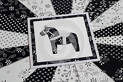 Handmade greeting card with Swedish Dala or Daleclarian horse floral folk pattern in black and white Stock Photo