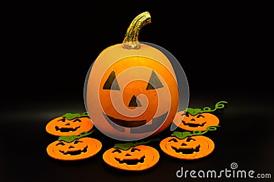 Handmade Halloween colored pumpkins isolated on black background. Studio shot. Stock Photo