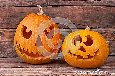 Handmade Halloween pumpkins on wooden background. Stock Photo