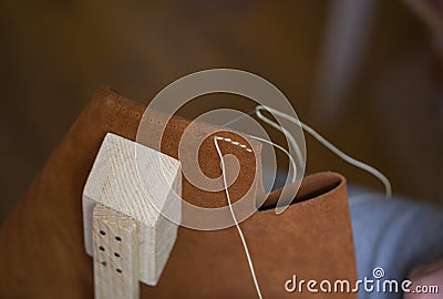 Handmade handicraft leather bag sewing process. Leather workshop, working with leather Stock Photo