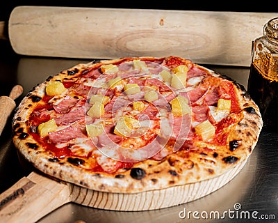 Handmade hawaiian pizza with fresh ingredients right out of the oven Stock Photo