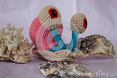 handmade knitted soft toy snail Harry Stock Photo