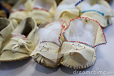 Handmade leather Native American Indian moccasins at a powwow in San Francisco Stock Photo