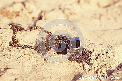 Handmade. Necklace on the sand on unny day Stock Photo