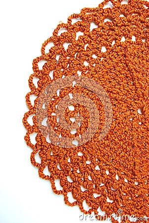 Handmade orange crochet doily Stock Photo