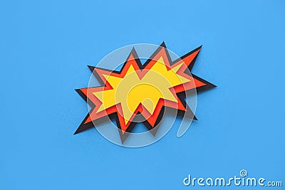 Paper comic speech bubble on blue background. Stock Photo