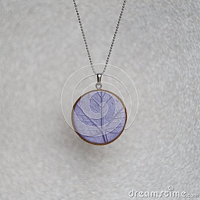 Handmade polymer clay necklace with leaf texture pendant Stock Photo