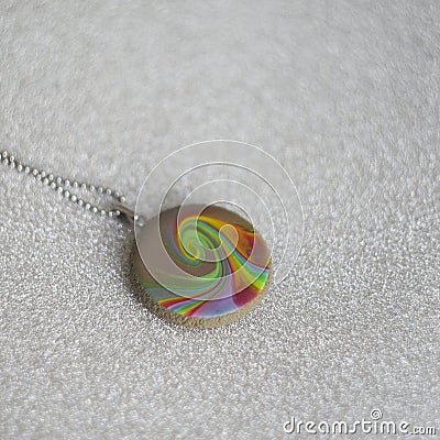 Handmade polymer clay necklace pendant rainbow swirl Stock Photo