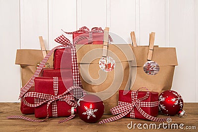 Handmade red christmas presents and bags. Stock Photo