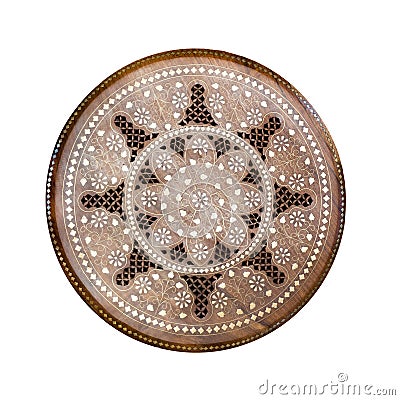 Handmade round wooden pattern. Ornamental circle floral decor panel with metal incrustation. Hadcraft vintage stool. Top view. Iso Stock Photo