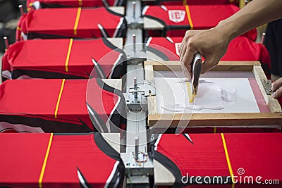 Handmade screen printing t-shirt, Workers are working Stock Photo