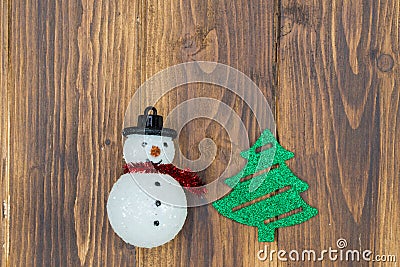 Handmade snowman with christmas tree on wooden background Stock Photo