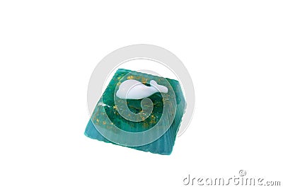 Handmade soap in the shape of a dolphin. Isolated on white background Stock Photo