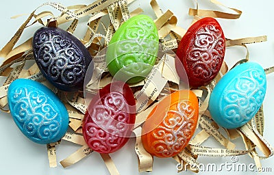 Handmade soap in the shape of multicolored eggs on a white Stock Photo