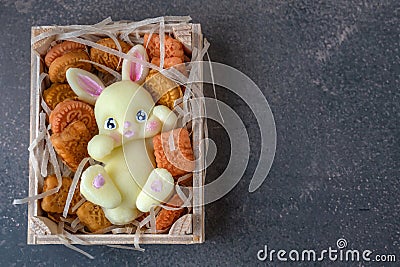 handmade soap in the shape of a rabbit. figurine of a white rabbit with cookies in a box for sale. Gift for Easter Stock Photo