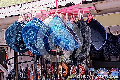 Handmade souvenirs of the mountain Crimea. Beautiful Muslim skull caps with an embroidered Oriental pattern Stock Photo