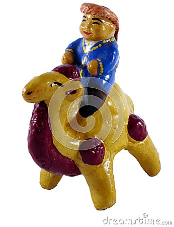 Handmade statuette of a camel rider. Stock Photo