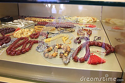 Handmade stone rosary in showcase Stock Photo