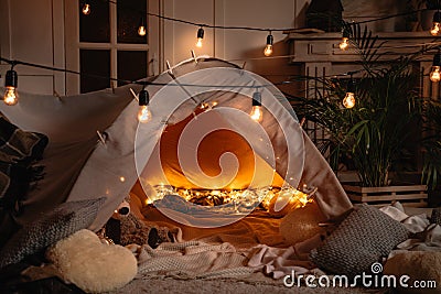 Handmade tent with blankets, pillows, toys and lights Stock Photo