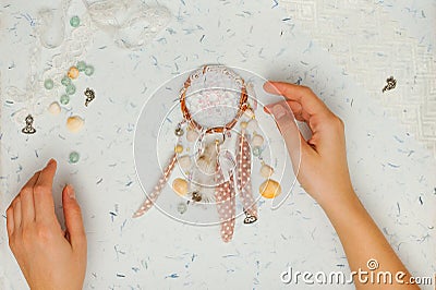 Handmade vintage dream catcher with woman hands Stock Photo