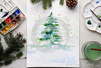 Handmade watercolor Christmas card on the work table Stock Photo