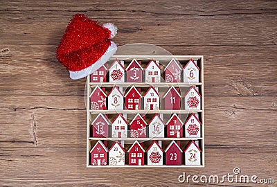 wooden perpetual calendar in a form of a house with christmas hat Stock Photo