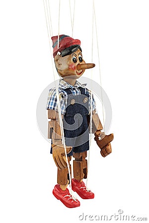 Handmade wooden puppet Pinocchio. Stock Photo
