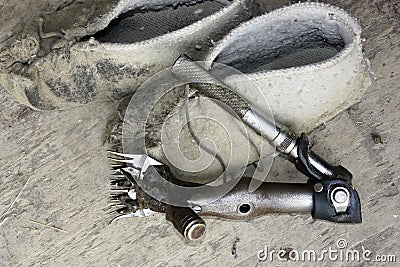 A handpiece and moccasins. Stock Photo