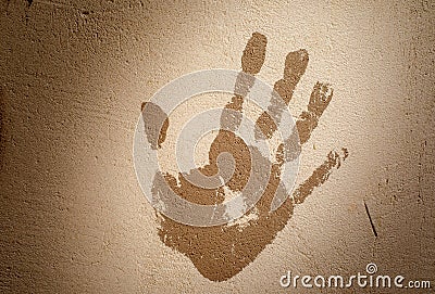 Handprint on the plastered wall. Stop concept. Toning Stock Photo