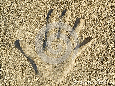 Handprint in the sand Stock Photo