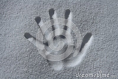 Handprint in snow Stock Photo