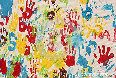 Handprints in different colors in a mural. Stock Photo