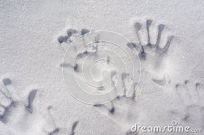 Handprints in the snow. Family fingerprints in the snow close-up and copy space. Stock Photo