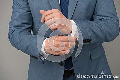Hands adjusting sleeves formal suit business outfit, perfectionism concept Stock Photo