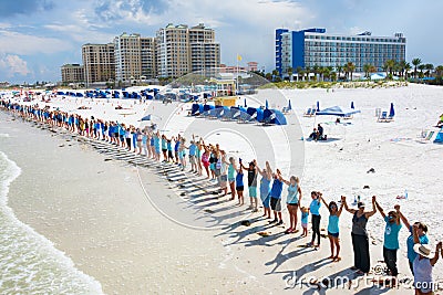 Hands Along the Water in Clearwater Beach Florida to protest toxic algae release from Lake Okeechobee Editorial Stock Photo