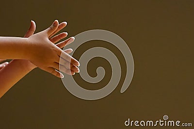 The hands of the audience clapping and cheering. Stock Photo