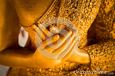 Hands of buddha statue touching the heart on chest level Stock Photo