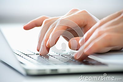 Hands of business man typing on a laptop. Stock Photo