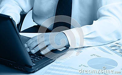 Hands of the businessman above the keyboard laptop Stock Photo