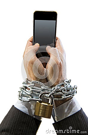 Hands of businessman addicted to work chain locked in mobile phone addiction Stock Photo