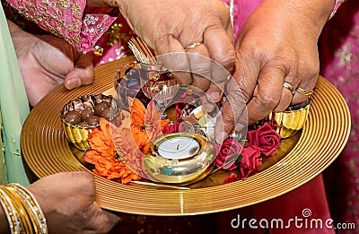 Hands and candles for mendhi henna wedding Stock Photo