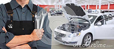 Hands of car mechanic with wrench Stock Photo