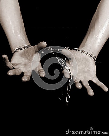 Hands chained up Stock Photo