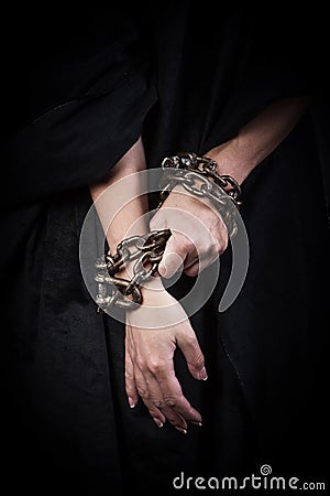 Hands in chains. Stock Photo