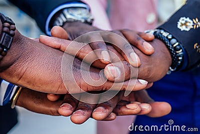 Hands closeup of group black afro american friends men businessmen in stylish business suit, expensive wristwatch Stock Photo